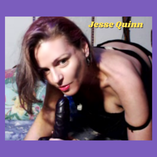 Cam model Jesse Quinn of IndieCamFans is on all fours, her head tilted with a seductive look in her eyes. Her red lips smile, inviting you to call.