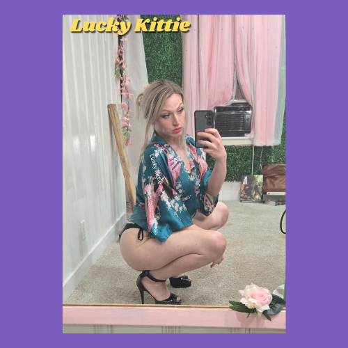 Indiecammodels FemDom cam model Lucky Kittie IndieCamFans crouching in high heels and satin.