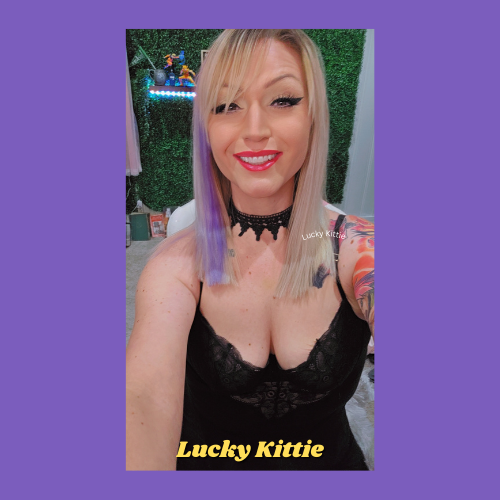 Indiecammodels FemDom cam model Lucky Kittiewearing a friendly smile on her red-painted lips, her beautiful hair down.